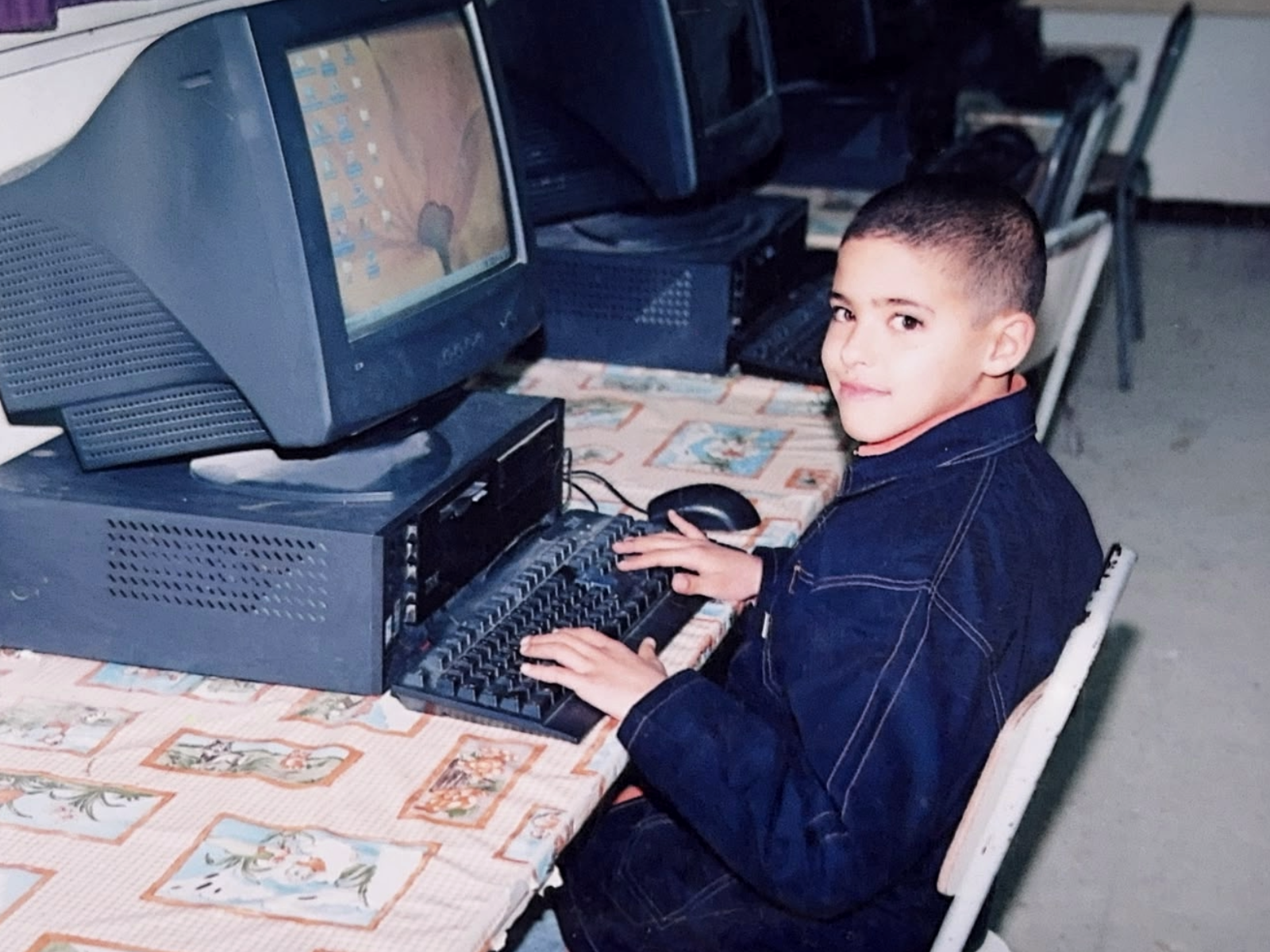 Young Mohamed at a computer